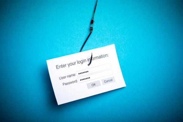 fishing hook going through a login screen on a blue background