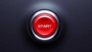 red button with the word start on a dark background