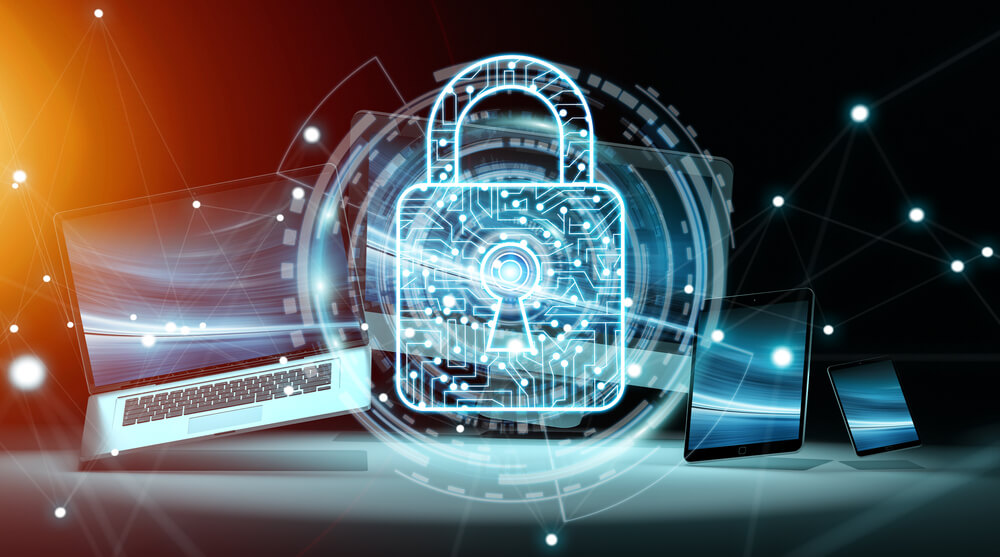 holographic blue padlock with laptop and devices in background concept